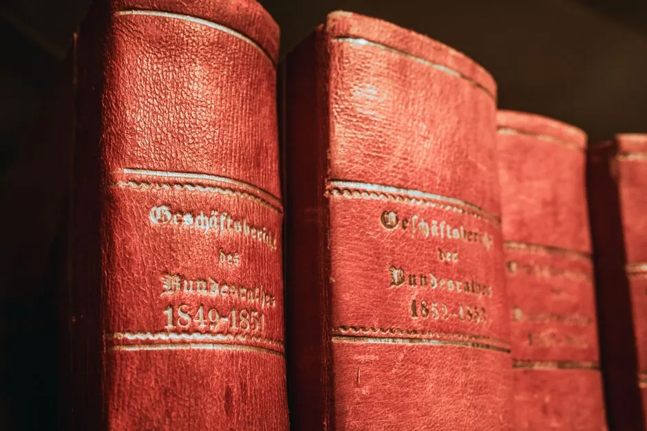 Bound newspaper archive volumes stacked on a library reading room table